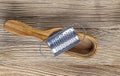 Wooden cheese grater on the old wooden background Royalty Free Stock Photo