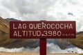 Wooden and cherry colored sign indicating the place \