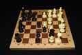 Wooden chess board and the chessmen as a strategy concept Royalty Free Stock Photo