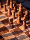 Wooden chess board with wooden pieces with sunlight Royalty Free Stock Photo