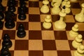 Wooden chess board under black pieces for hobby theme Royalty Free Stock Photo