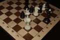 Wooden chess board under the pieces for game backdrop Royalty Free Stock Photo