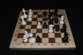 Wooden chess board with white pieces as a hobby backdrop Royalty Free Stock Photo