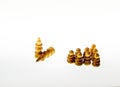 Wooden chess pieces against white background