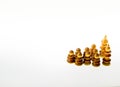 Wooden chess pieces against white background