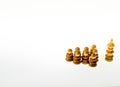 Wooden chess pieces against white background