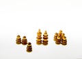 Wooden chess pieces against white background