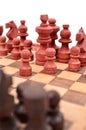 Wooden chess pieces on a chess board is unique Royalty Free Stock Photo