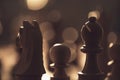 Wooden chess pieces on the chessboard and dim light Royalty Free Stock Photo