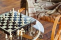 Wooden chess pieces on chessboard outdoor at the sunny day, at terrace house. Royalty Free Stock Photo