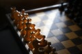 wooden chess pieces on an old board Royalty Free Stock Photo