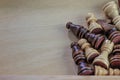 Wooden chess pieces wooden background. Royalty Free Stock Photo