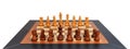 Wooden chess set. Leather frame, close up view, details, white background. Royalty Free Stock Photo