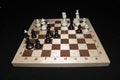 Wooden chessboard with white pieces for skill theme Royalty Free Stock Photo