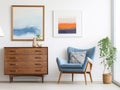 Wooden chest of drawers and posters on the white wall. Interior design of modern living room Royalty Free Stock Photo