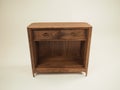 Wooden chest of drawers on a white background.