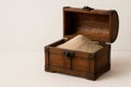 A wooden chest filled with sand. Space for text. Royalty Free Stock Photo