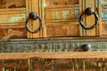 a wooden chest made of recycled old ship planks with rivets and metal rings