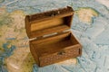 Wooden chest on the map Royalty Free Stock Photo