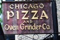 Wooden Chicago Pizza and Over Grinder Co. sign in Chicago.