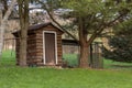 Wooden Chicken Coop in Rural backyard with fence