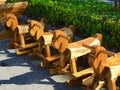 Wooden children`s rocking horses arranged neatly for sale. Royalty Free Stock Photo