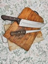 Wooden chopping board with kitchen knives Royalty Free Stock Photo