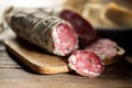 Chopping board with sliced salami Royalty Free Stock Photo