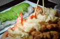 Chopstick over shrimp tempura in the table Royalty Free Stock Photo