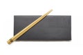 Wooden chopsticks on black box isolated on white background Royalty Free Stock Photo