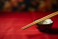 Wooden Chopsticks, Bowl on a table, Red Background