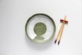 Wooden Chopsticks and Ceramic plate green oriental style Royalty Free Stock Photo