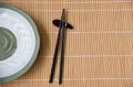 Wooden Chopsticks and Ceramic plate green oriental style Royalty Free Stock Photo