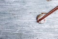 Wooden chopsticks and chopstick rest on rustic wooden background. Top view. Royalty Free Stock Photo