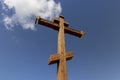 wooden christian cross on a blue sky background Royalty Free Stock Photo