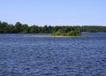 Wooden Christian cross on a small island on Lake Onega Royalty Free Stock Photo