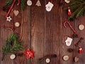 Wooden christmas abstract background with fir tree, cones, candy canes and natural decor. New year concept Royalty Free Stock Photo
