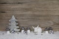 Wooden christmas background with decoration in white, silver and Royalty Free Stock Photo