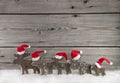 Wooden christmas background with a group of santa clause on wood