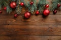 Wooden Christmas background with red baubles decoration and fir tree branches.Christmas holiday celebration, winter, New Year Royalty Free Stock Photo