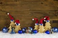 Wooden christmas background with red, white, brown and blue deco