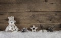 Wooden christmas background with a snowman and natural decoration. Royalty Free Stock Photo