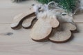 Wooden Christmas decorations - Christmas mittens and socks on a white wooden background with a Christmas tree Royalty Free Stock Photo