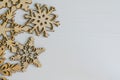 Wooden christmas decorations snowflakes on white wooden painted background Royalty Free Stock Photo