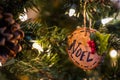 Wooden christmas ornament on a tree