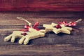 Wooden christmas ornaments on a rustic wooden surface Royalty Free Stock Photo