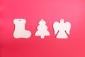 Wooden Christmas toys on a red background. Blanks: angel, boot, tree. Natural Christmas decor concept. Royalty Free Stock Photo