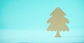 Wooden Christmas tree on blue background with copy space. New Year party. Winter holiday concept. Greeting card in minimal style. Royalty Free Stock Photo