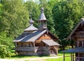 Wooden church against the wood.Open-air museum of ancient wooden architecture. Russia. Vitoslavlitsy, Great Novgorod.