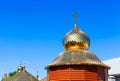 Wooden church with golden cupola Royalty Free Stock Photo